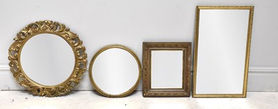 Lot 1014 - Four decorative mirrors, including a circular...