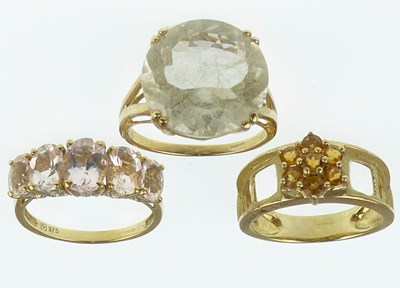 Lot 1098 - Three 9ct gold dress rings, one with large cut...