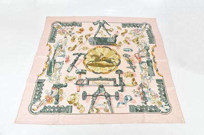 Lot 693 - HERMÈS; a 100% silk twill 'Copeaux' pink, gold...