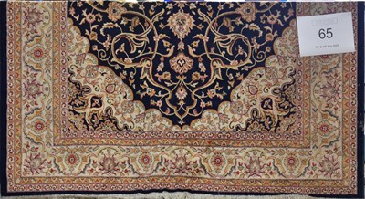 Lot 65 - Two modern machine made carpets, a red ground...