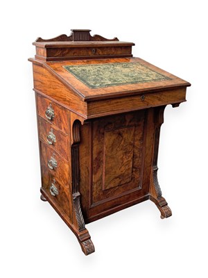Lot 1122 - A 19th century walnut Davenport, with an...