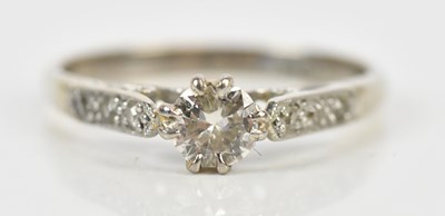 Lot 390 - A white metal diamond set dress ring, with...