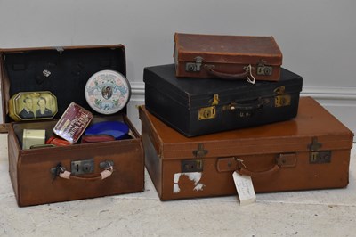 Lot 1165 - A collection of four vintage suitcases,...