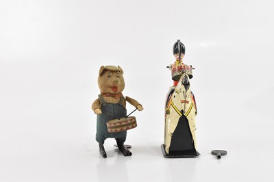 Lot 1429 - SCHUCO; a vintage windup clockwork pig drummer,...
