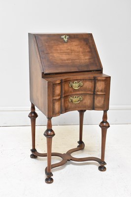 Lot 60 - A reproduction Queen Anne Revival walnut...