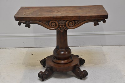 Lot 102 - A 19th century carved mahogany fold-over tea...