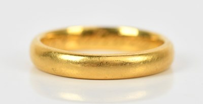 Lot 409 - A 22ct yellow gold wedding band, size K 1/2,...