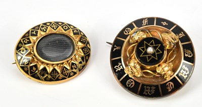 Lot 76 - Two Victorian gilt metal and black enamel...
