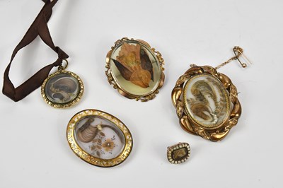 Lot 77 - Four Victorian gilt metal mourning brooches,...