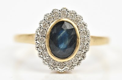 Lot 486 - A 9ct yellow gold diamond and sapphire set...
