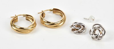 Lot 193 - A pair of yellow metal hoop earrings, stamped '...