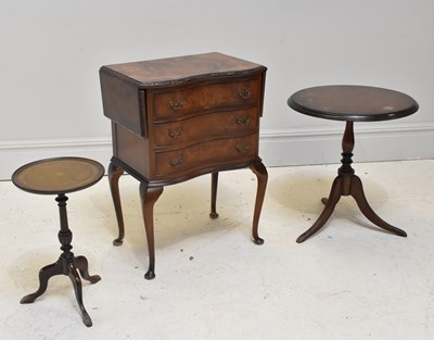 Lot 1055 - A reproduction walnut three drawer drop-leaf...