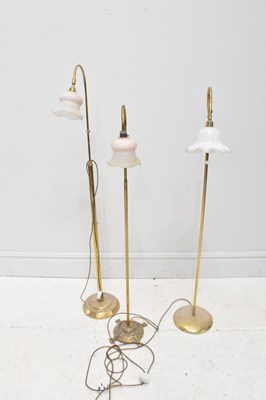 Lot 1808 - Three modern brass lamps, largest 150cm.
