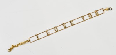 Lot 54 - A gold plated chain with the words 'I Love You'...