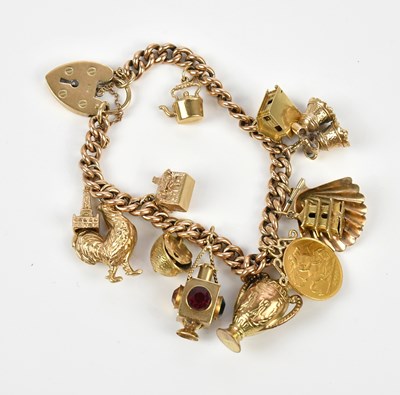 Lot 17 - A 9ct yellow gold curb link bracelet with 9ct...