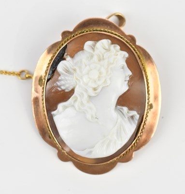 Lot 110 - A yellow metal mounted cameo style brooch,...