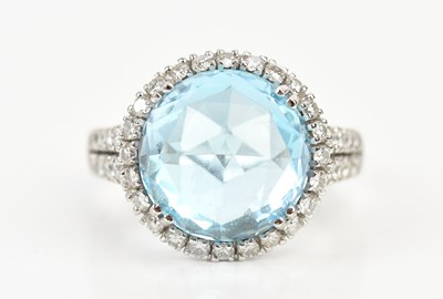 Lot 371 - An 18ct white gold diamond and blue topaz set...