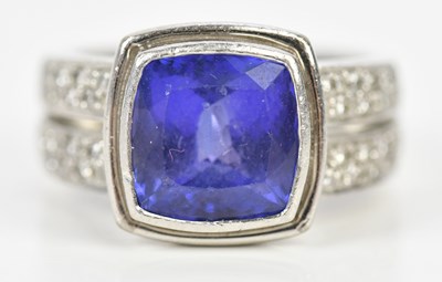 Lot 327 - A platinum diamond and tanzanite set dress...