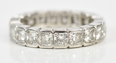 Lot 326 - A platinum radiant cut diamond full eternity...