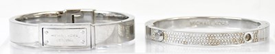 Lot 829 - MICHAEL KORS; two stainless steel fashion...