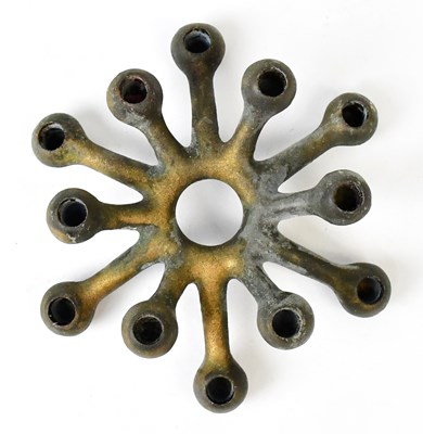 Lot 417 - DANSK DESIGNS LTD; a cast metal candleholder...