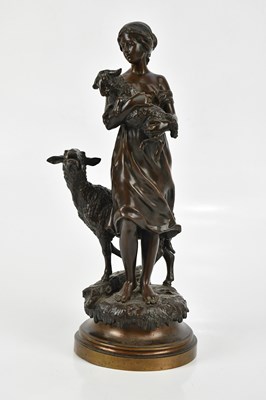 Lot 1491 - A bronze figure of maiden with sheep and lamb,...