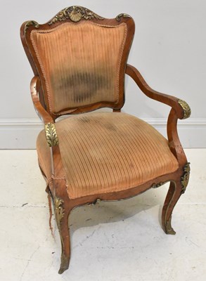 Lot 1127 - A Louis XV style walnut veneered armchair.