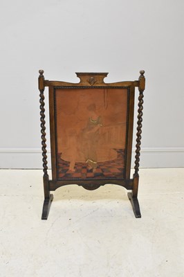 Lot 1159 - An early 20th century oak firescreen, with...