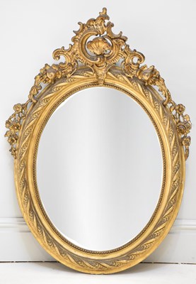 Lot 21 - A 19th century Rococo style gilt framed oval...