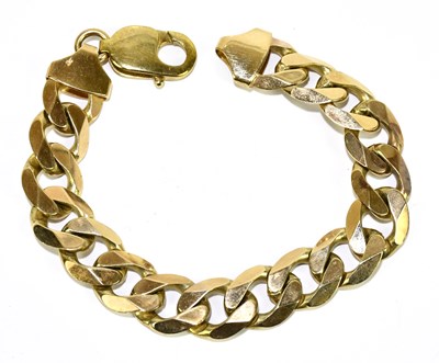 Lot 1244 - A yellow metal curb link bracelet stamped 375,...