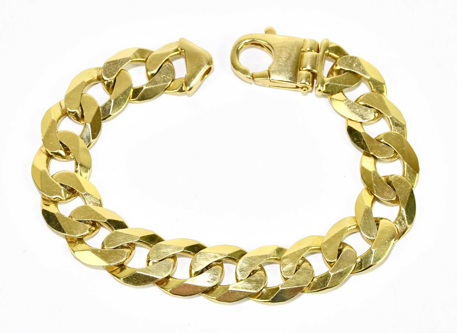 Lot 1245 - A yellow metal curb link bracelet, stamped