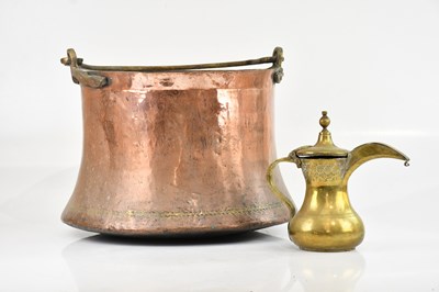 Lot 425 - An Eastern brass coffee pot with embossed...