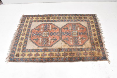 Lot 245 - An eastern hand knotted woollen rug with...