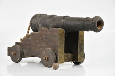 Lot 1298 - A small cannon, on a later associated stand,...