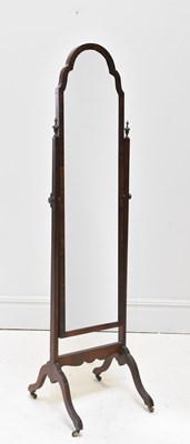 Lot 168 - A 1950s walnut framed cheval mirror, height...