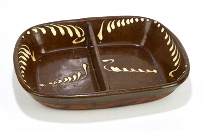 Lot 652 - A 19th century slipware two division dish,...