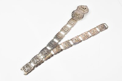 Lot 2058 - An Egytian white metal belt, decorated with...