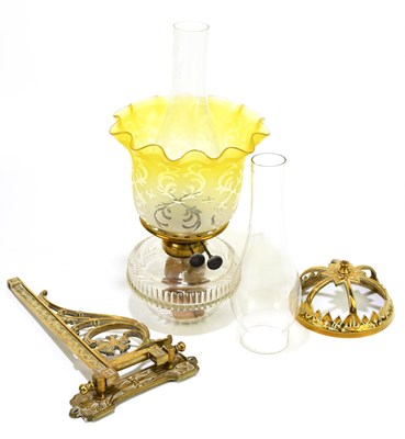 Lot 265 - A Victorian wall mounted oil lamp with brass...