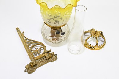 Lot 265 - A Victorian wall mounted oil lamp with brass...