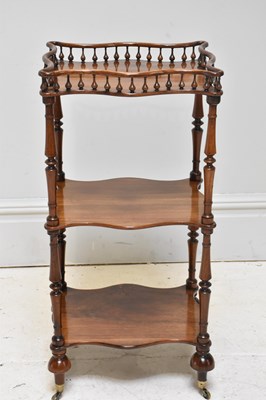 Lot 1160 - A Victorian walnut three tier whatnot, height...