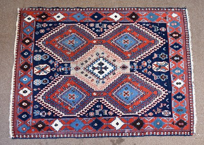 Lot 2678 - A Caucasian wool rug,with geometric decoration...