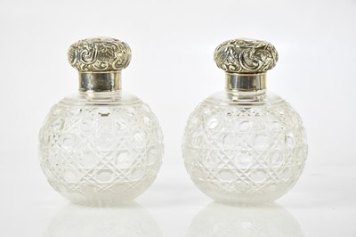 Lot 2158 - A pair of hobnail cut glass perfume bottles of...