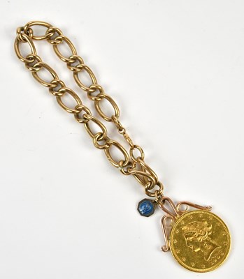 Lot 18 - An American gold ten dollar coin, dated 1906,...