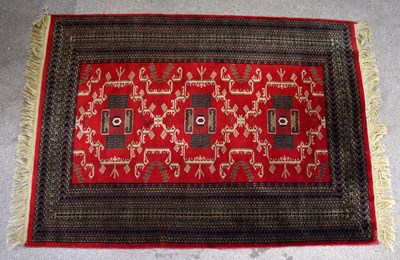 Lot 2680 - An Eastern rug with elephant foot style...