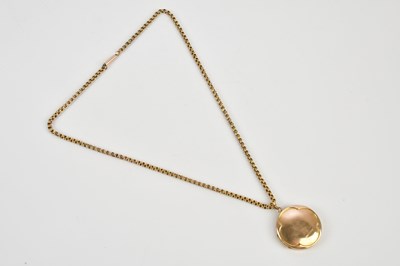 Lot 254 - A 9ct yellow gold circular locket, suspended...