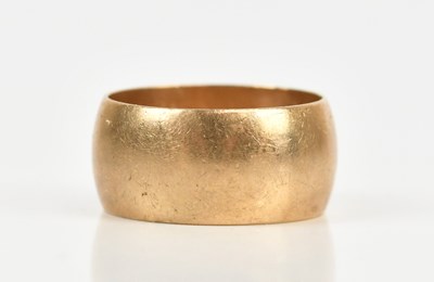 Lot 457 - A 9ct yellow gold wedding band, size Q,...