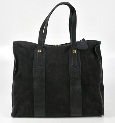 Lot 704 - LOEWE; a navy blue pebbled leather and suede...