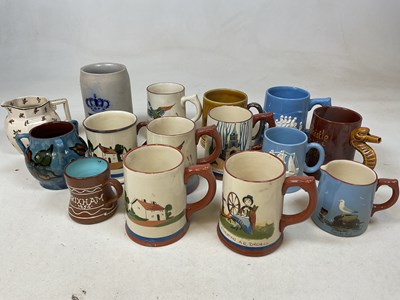 Lot 271 - A group of Dartmouth and Torquay ware mugs and...