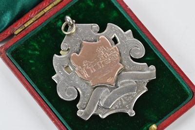 Lot 2126 - A hallmarked silver and yellow metal fob medal,...