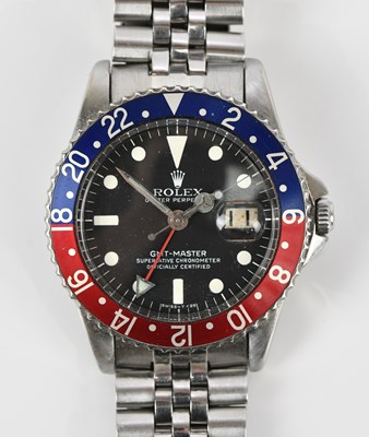 Lot 544 - ROLEX; a gentleman's stainless steel GMT...